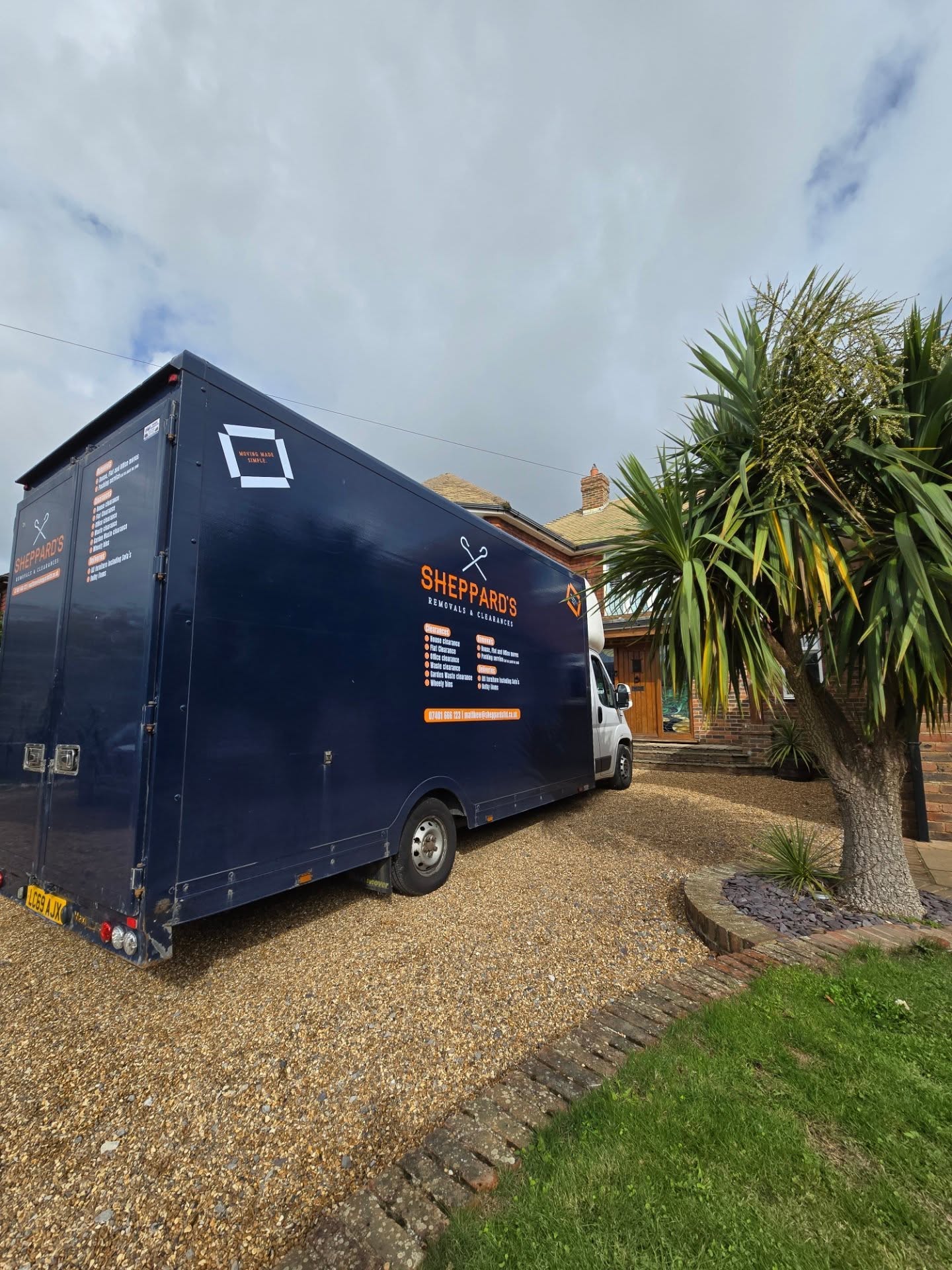 Blue moving truck labeled